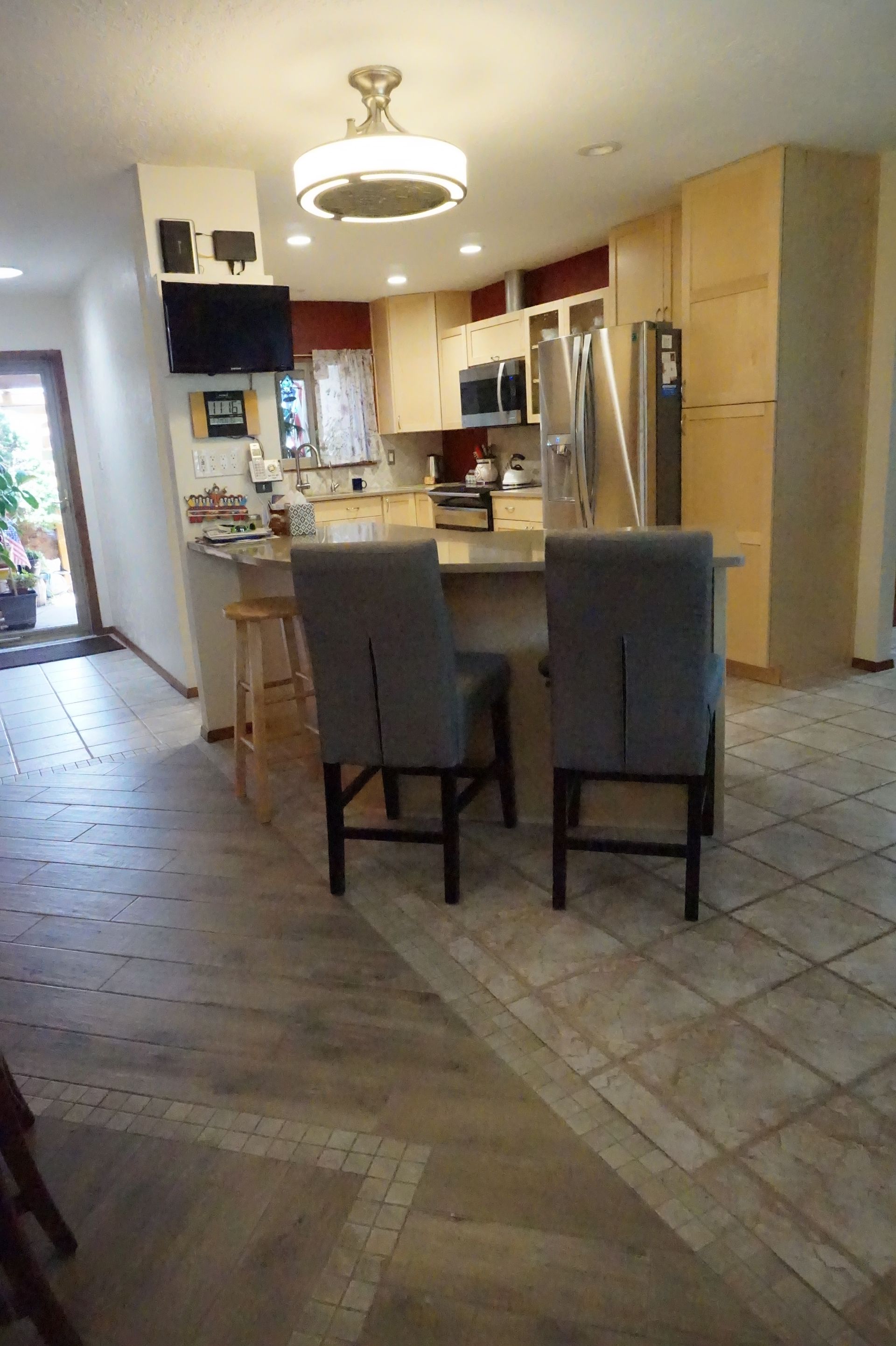 a kitchen with a table and chairs in it