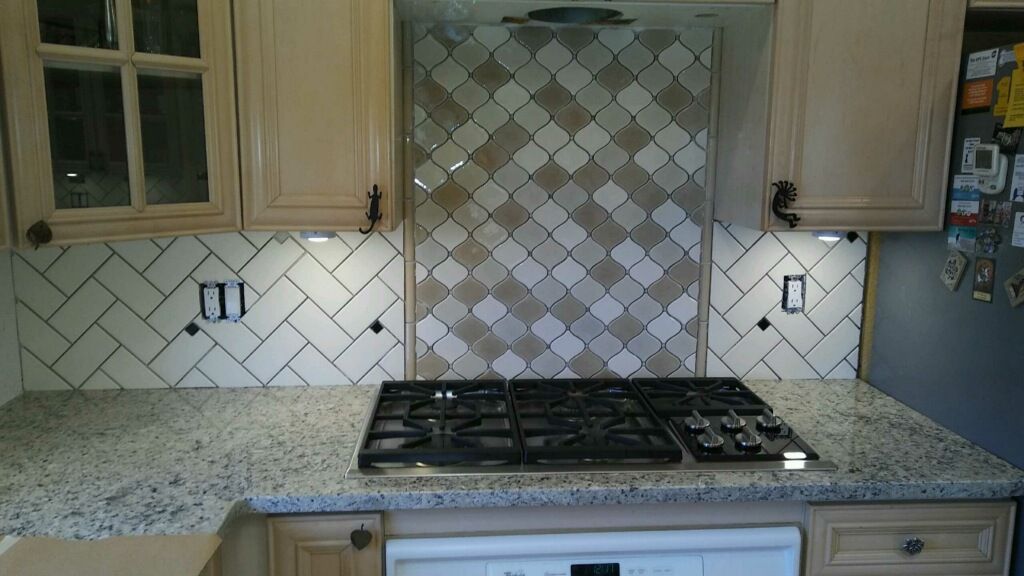 a kitchen with a stove top oven and a dishwasher