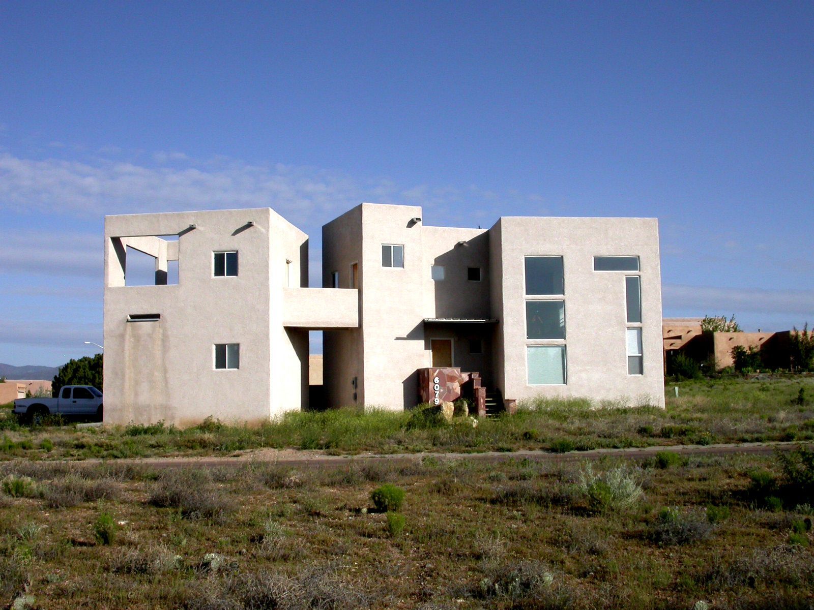 a house with a truck parked in front of it