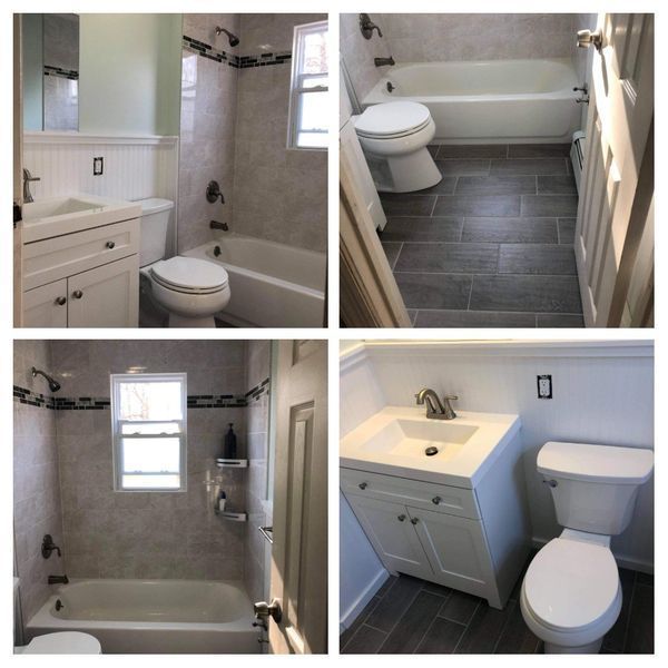 Four photos of a remodeled bathroom. White cabinets, gray tile, and a bathtub are seen.