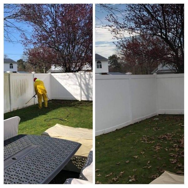 Before and after of a white fence being cleaned; person in yellow suit spraying, clean fence on the right.