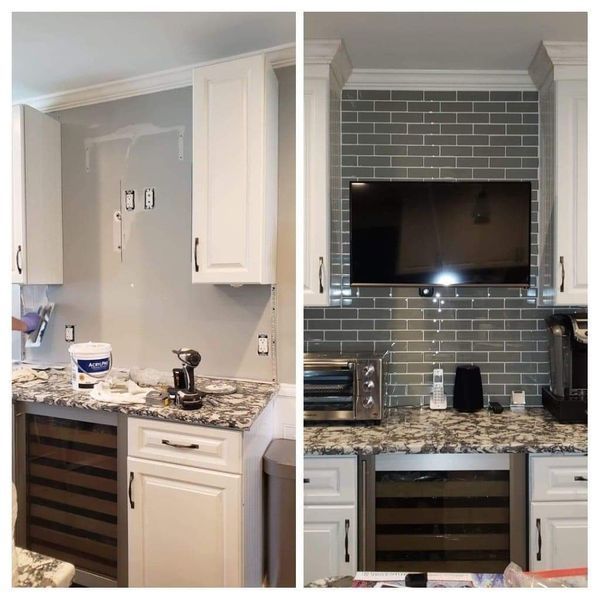 Kitchen renovation: before and after. Gray tile backsplash installed, TV mounted above countertop, white cabinets.