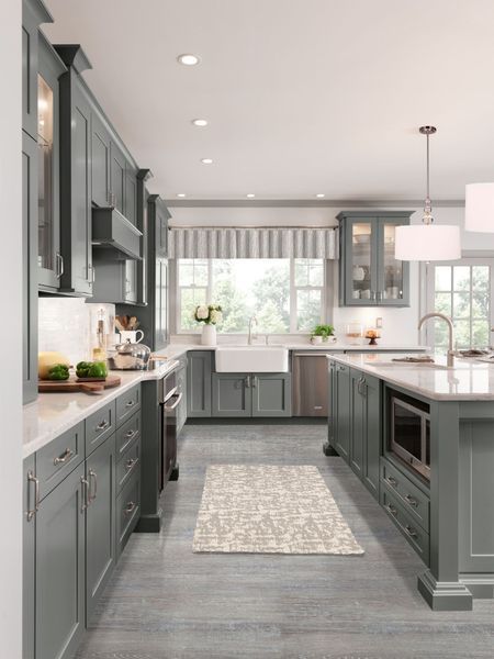 Gray kitchen with island, white countertops, and a farmhouse sink.
