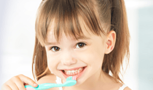 Cute baby holding toothbrush