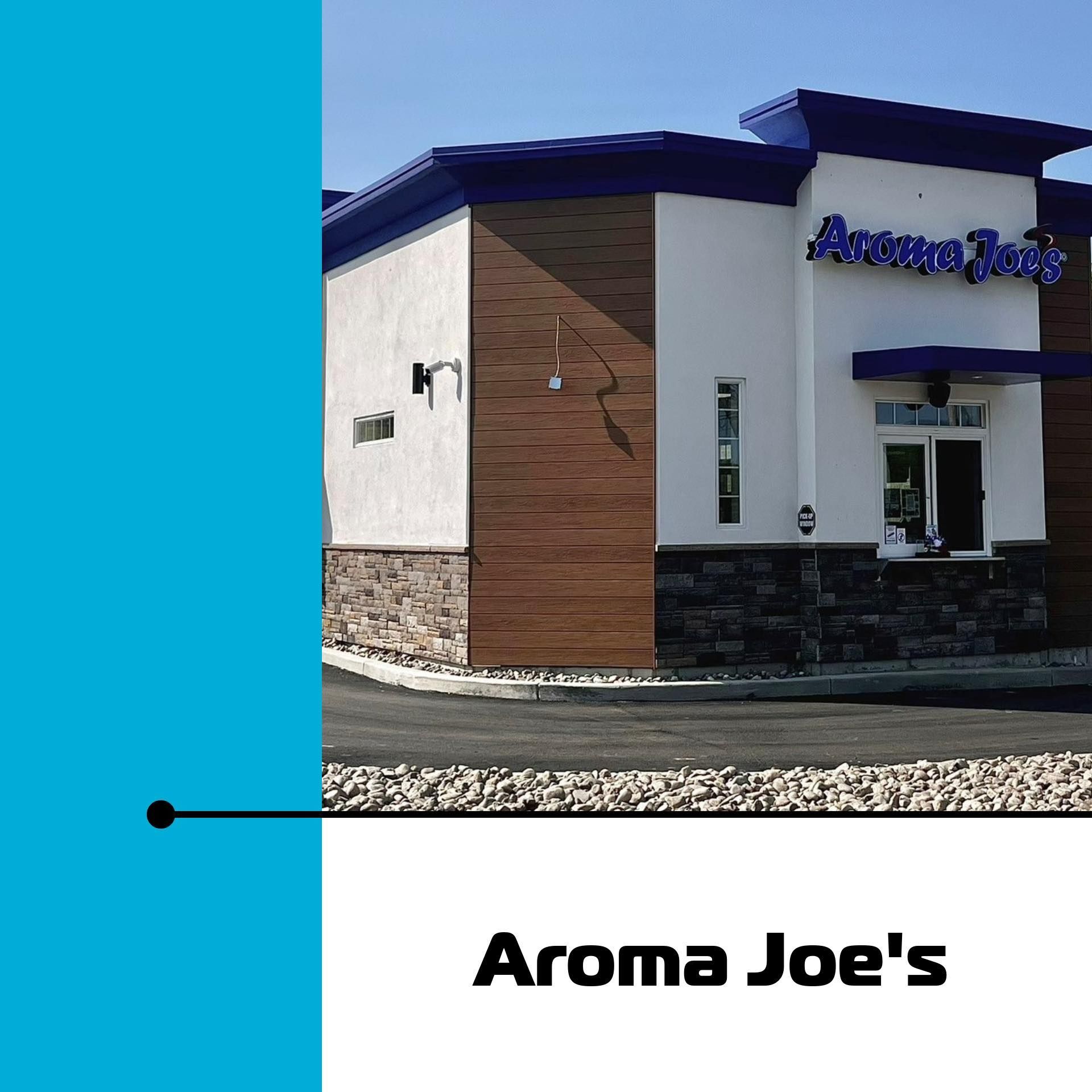 Aroma Joe's coffee shop exterior with white walls, blue trim, and drive-thru window.