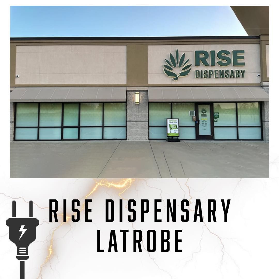 Exterior of Rise Dispensary in Latrobe, Pennsylvania, with a green logo and sign.