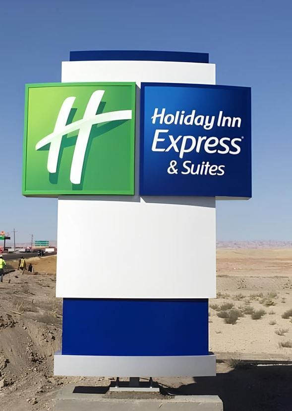 A blue and white sign for holiday inn express and suites.