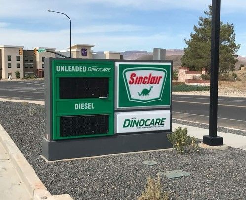 A gas station with a sign that says sinclair on it.