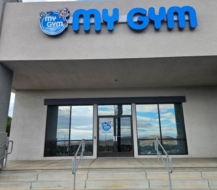 The front of a gym with stairs leading up to it