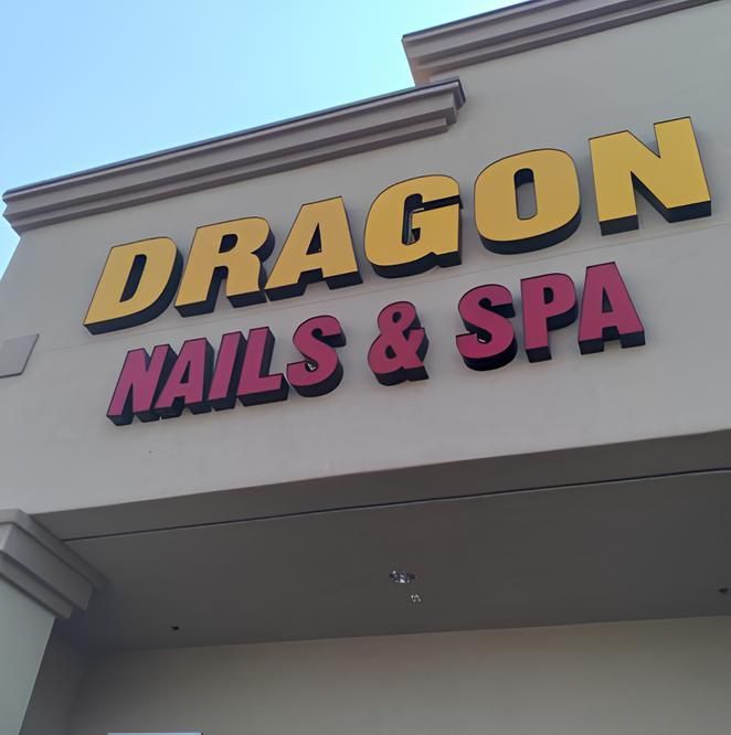 A dragon nails and spa sign on a building