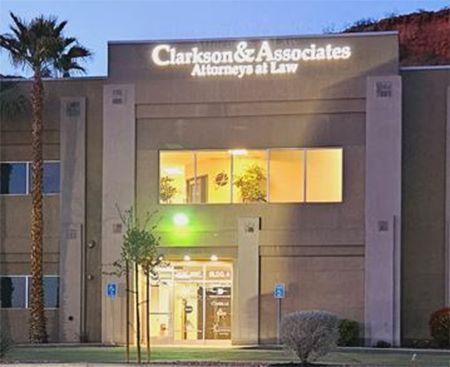a building with a sign that says clarkson & associates attorneys at law