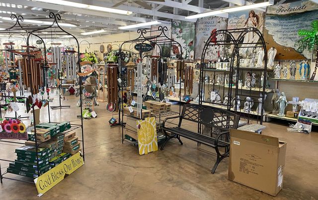 A store filled with lots of decorations and a bench.