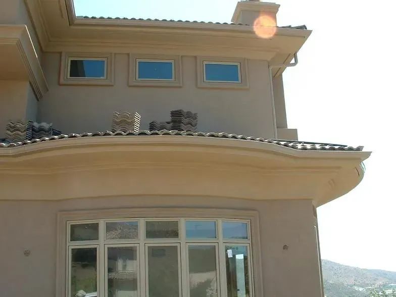 A large house with a balcony and a lot of windows