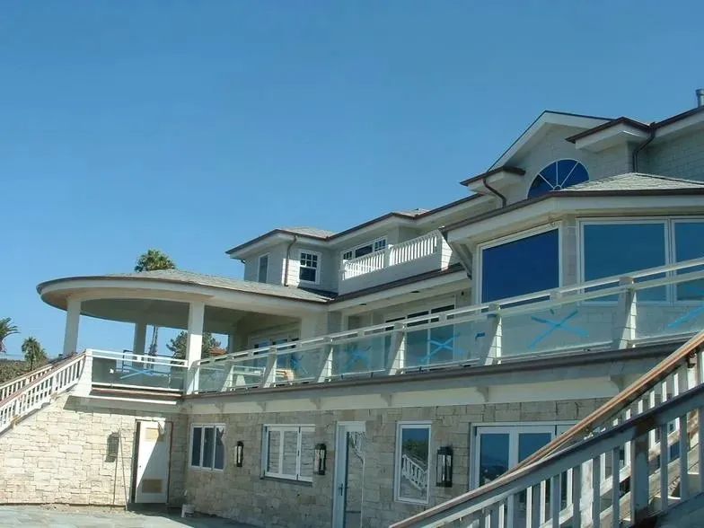 A large house with stairs leading up to it