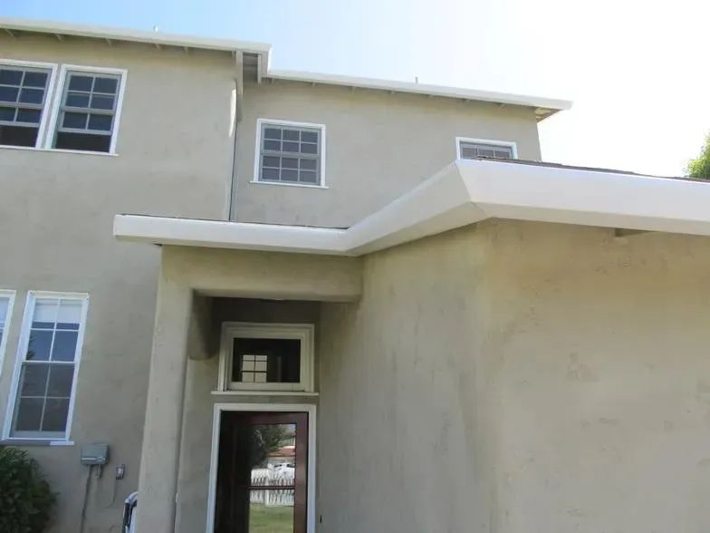A house with a lot of windows and a door