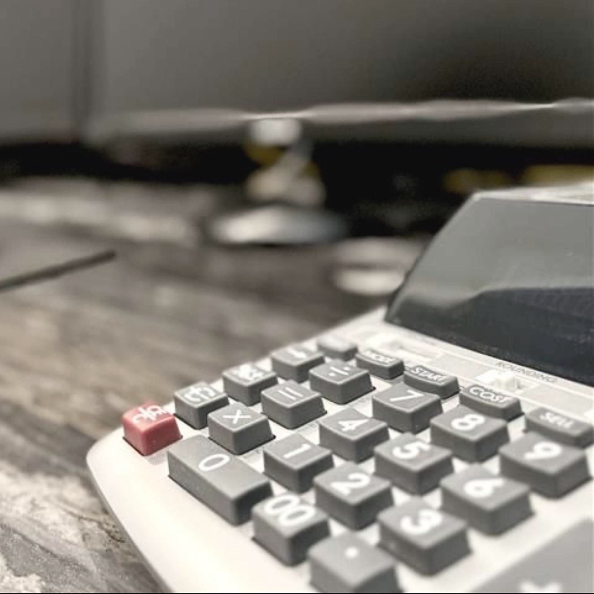 A close up of a calculator on a table