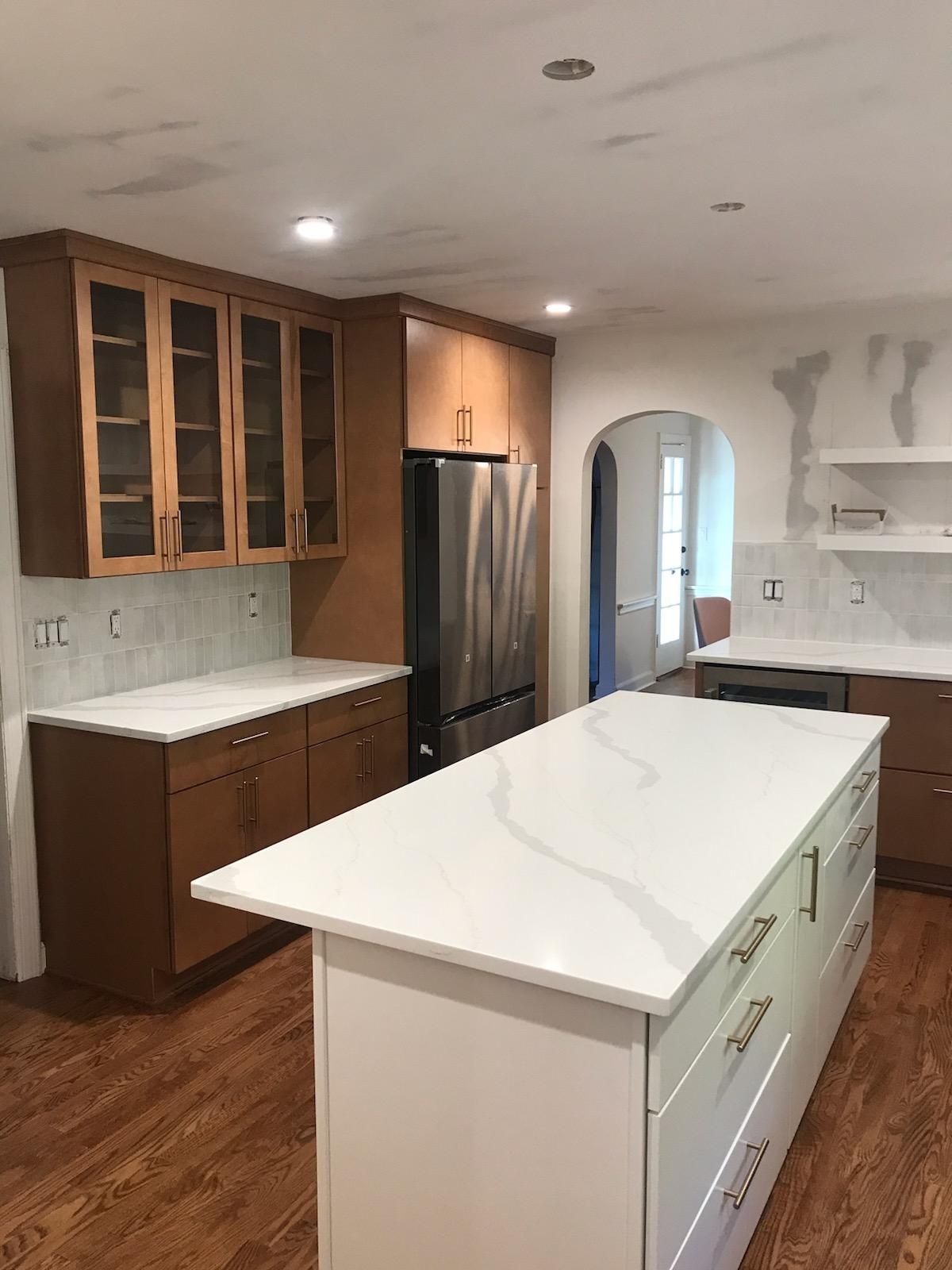 A kitchen with a large island in the middle of it.