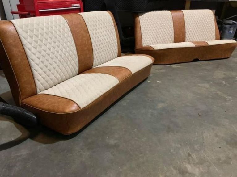Two-tone car seats with diamond-patterned cream centers, surrounded by brown, on a concrete floor.