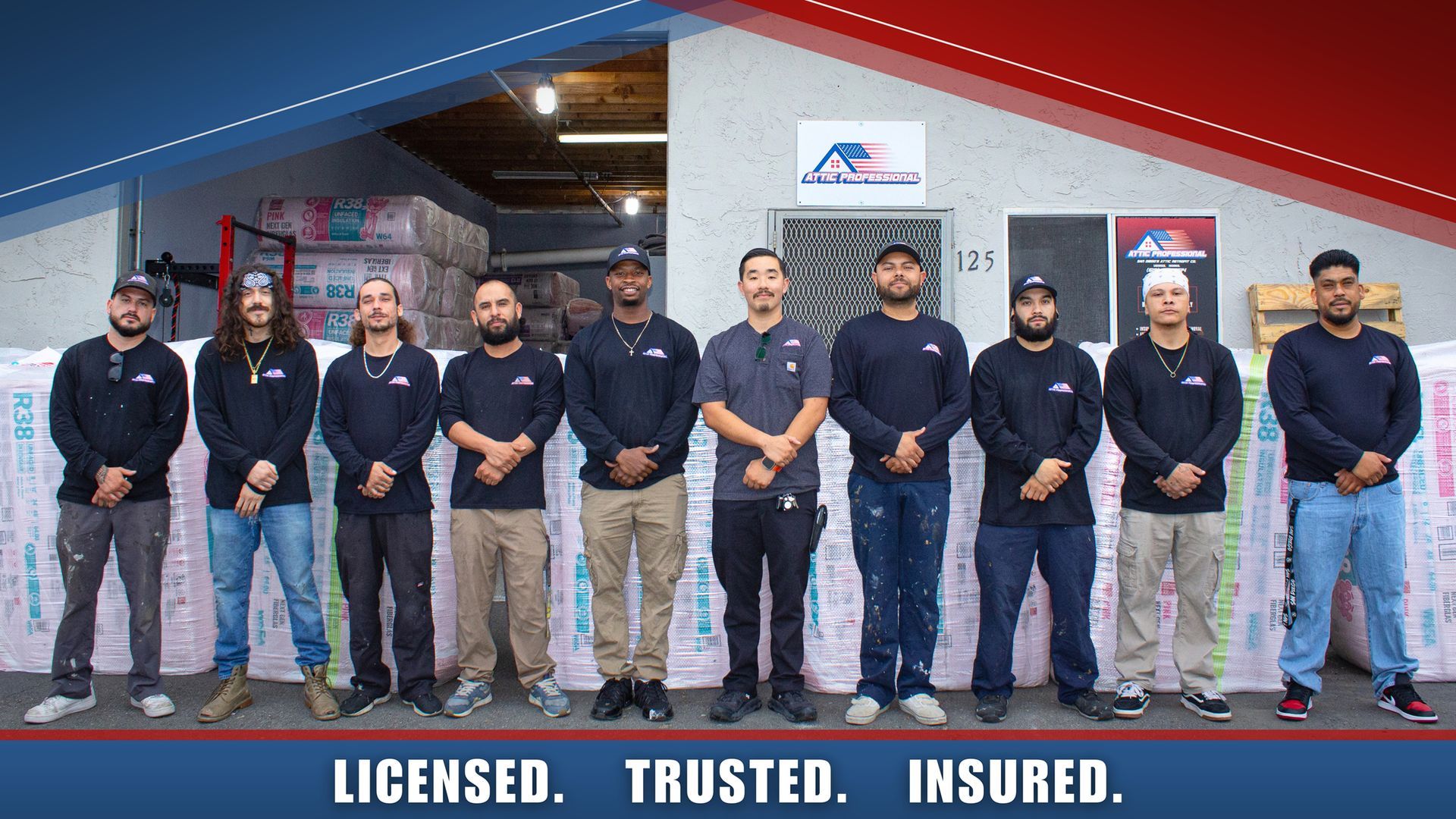 The Attic Professional Team Attic Professional team photo of all team members standing side-by-side with blue and red graphics and text saying