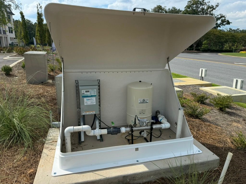 A white box with a water pump inside of it.