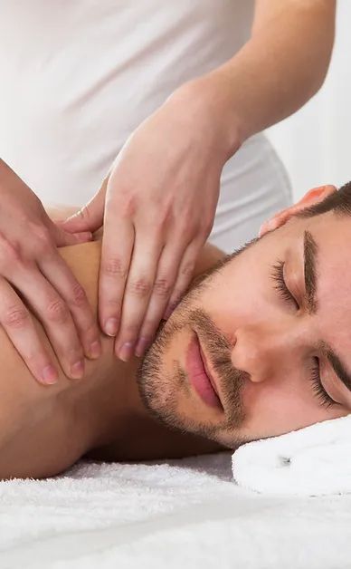 A man is getting a massage at a spa.