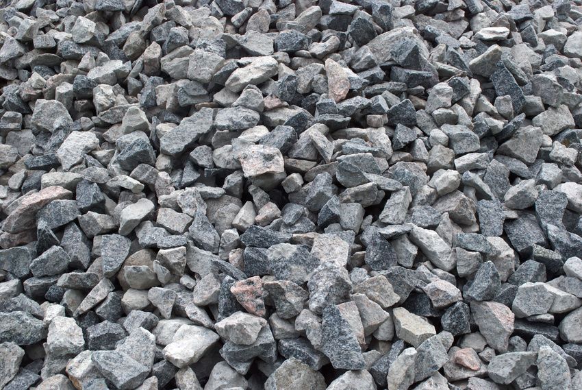 A pile of gravel is sitting on the ground.
