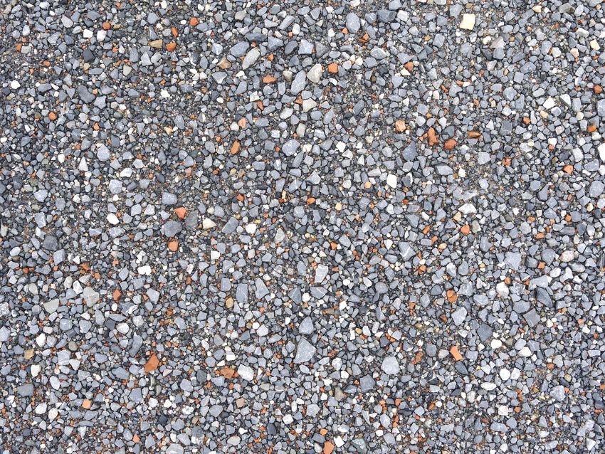 A close up of a pile of gravel on a beach.