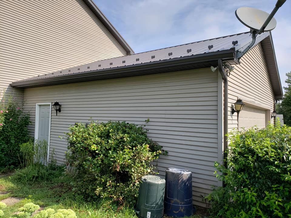 A house with a satellite dish on the side of it.