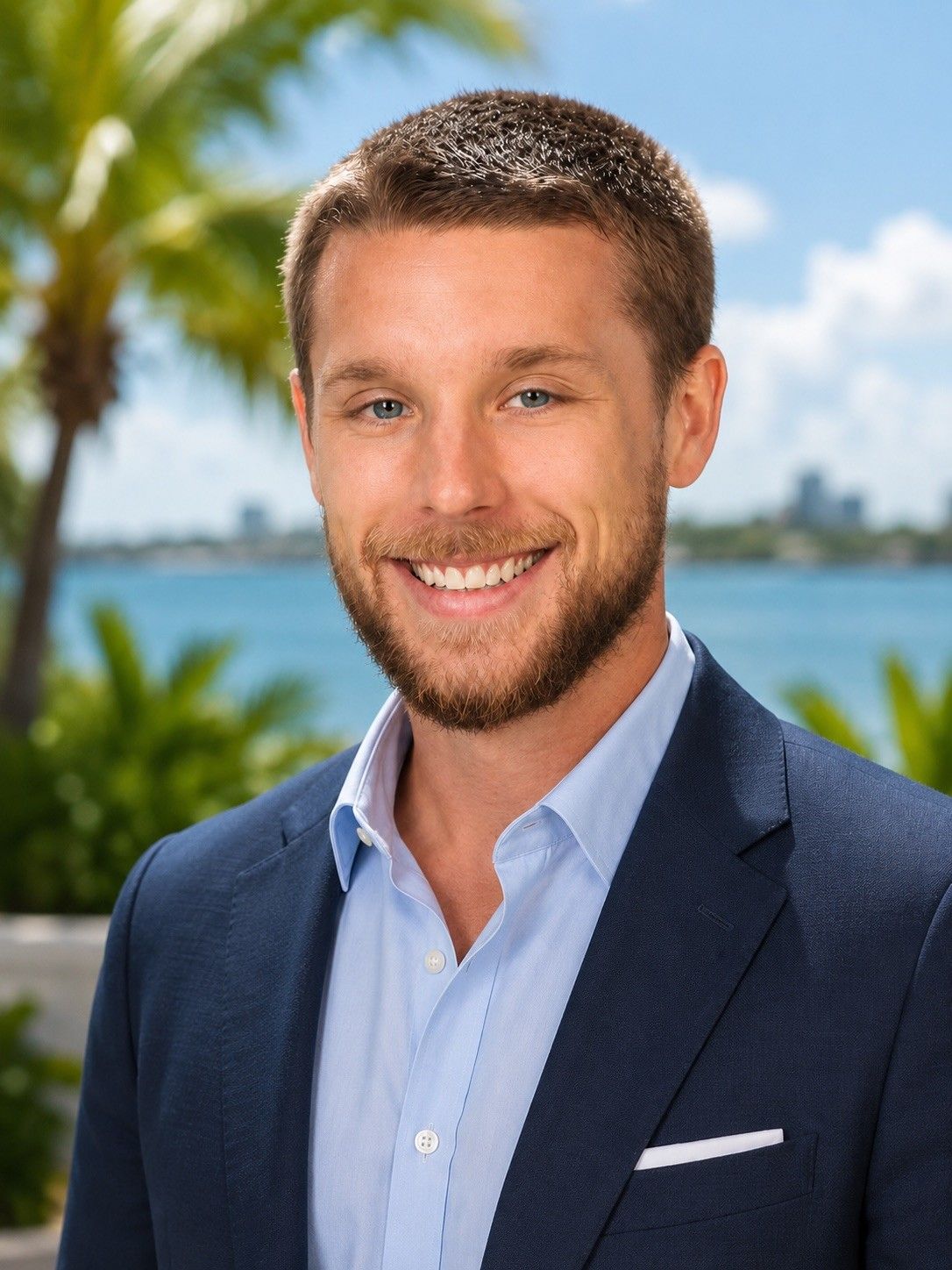 A man in a suit and tie is smiling for the camera, named Daniel Weixelbaum.