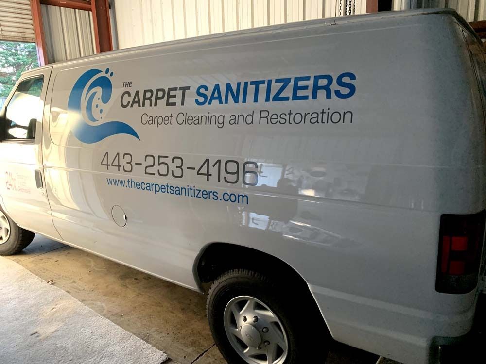 White van with blue logo for 