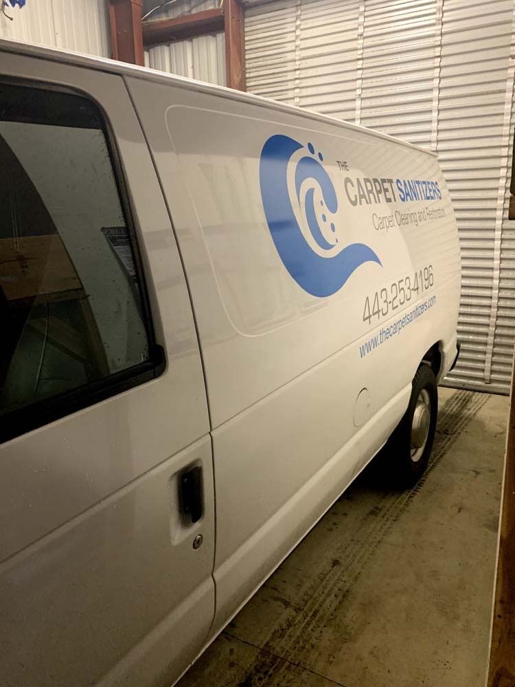 White van with blue logo for 