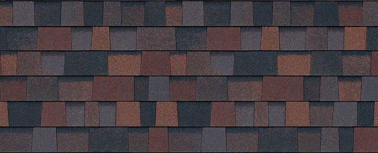 A close up of a roof with a lot of shingles on it.