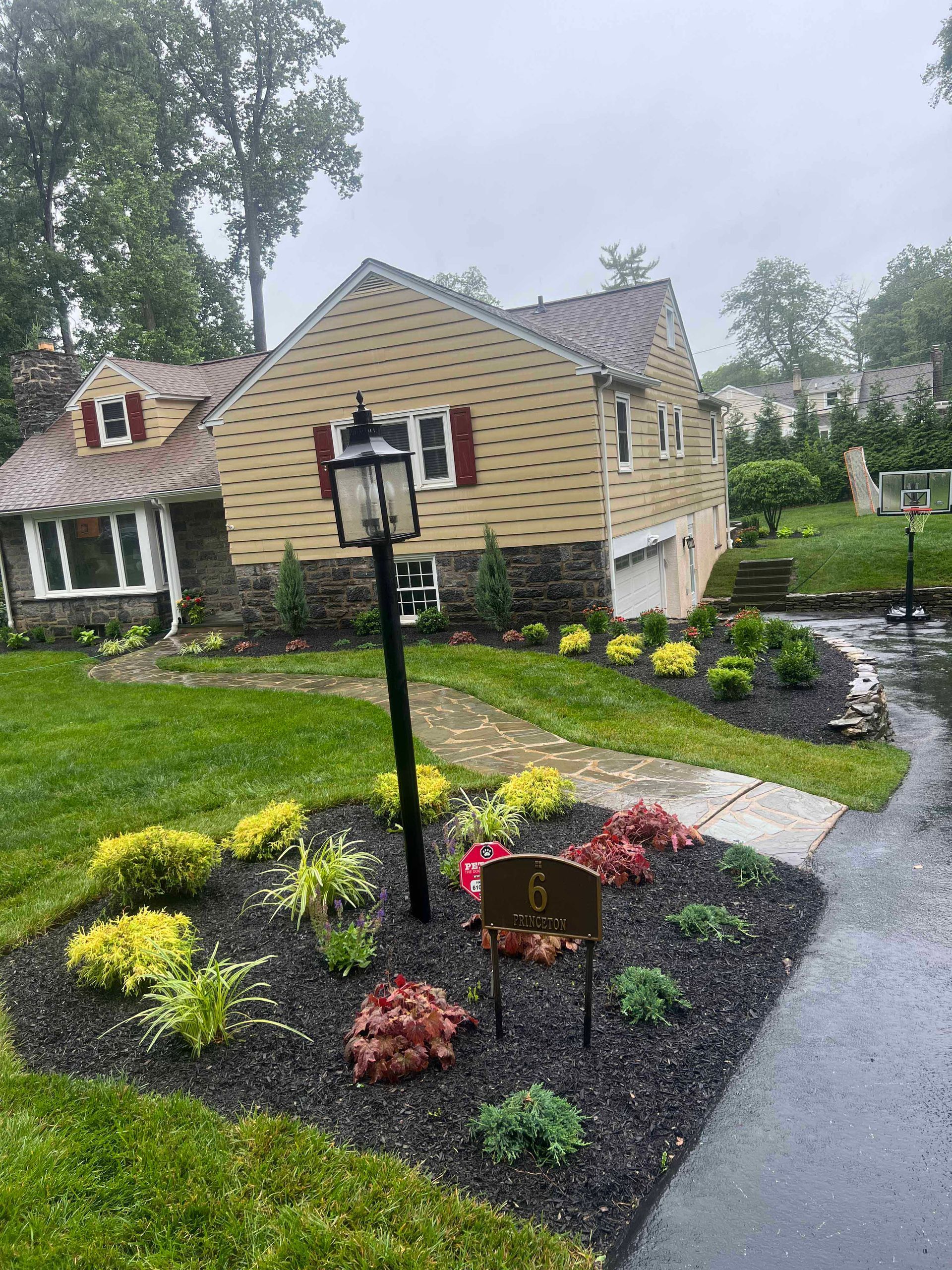 A house with a lamp post in front of it.