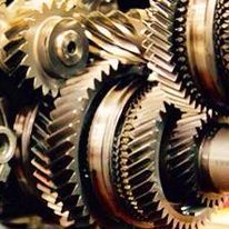 A close up of a group of gears in a machine.