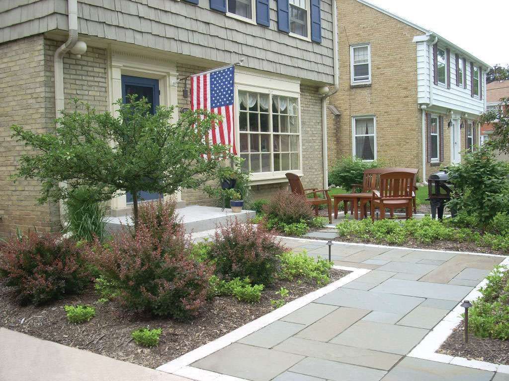 A house with an american flag in front of it.