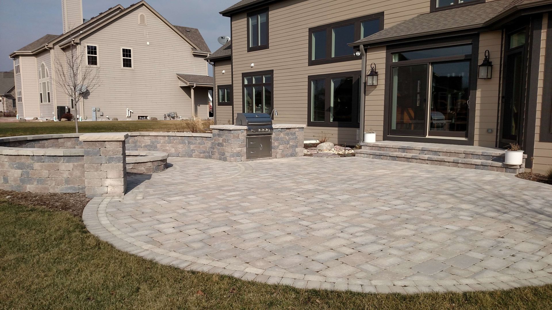 A large house with a patio in front of it