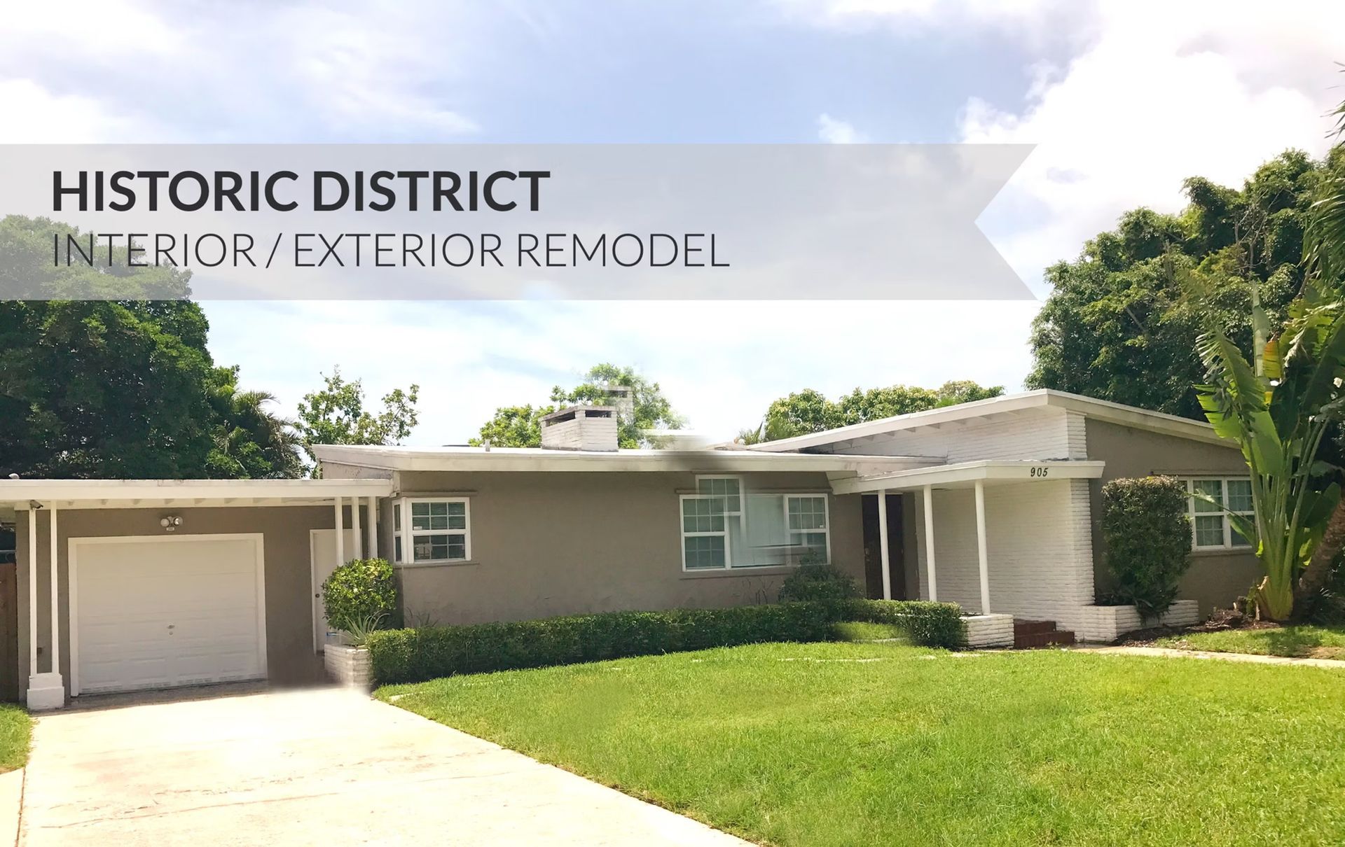 Historic district home exterior remodel on a sunny day with a green lawn and single-car garage