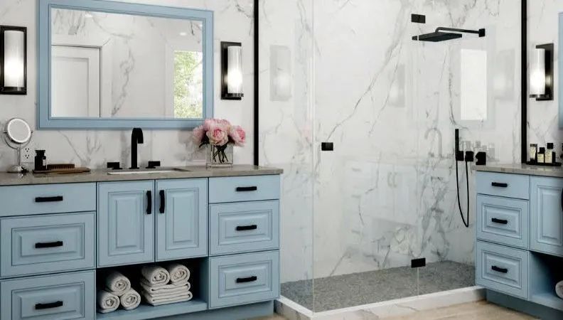 Light blue double vanity bathroom with large mirror, wall sconces, and marble walk-in shower