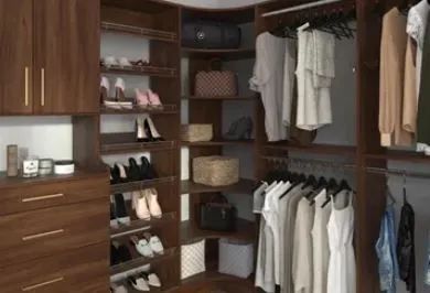 Walk-in closet with dark wood cabinets, shelves, hanging clothes, shoes, and woven storage baskets.