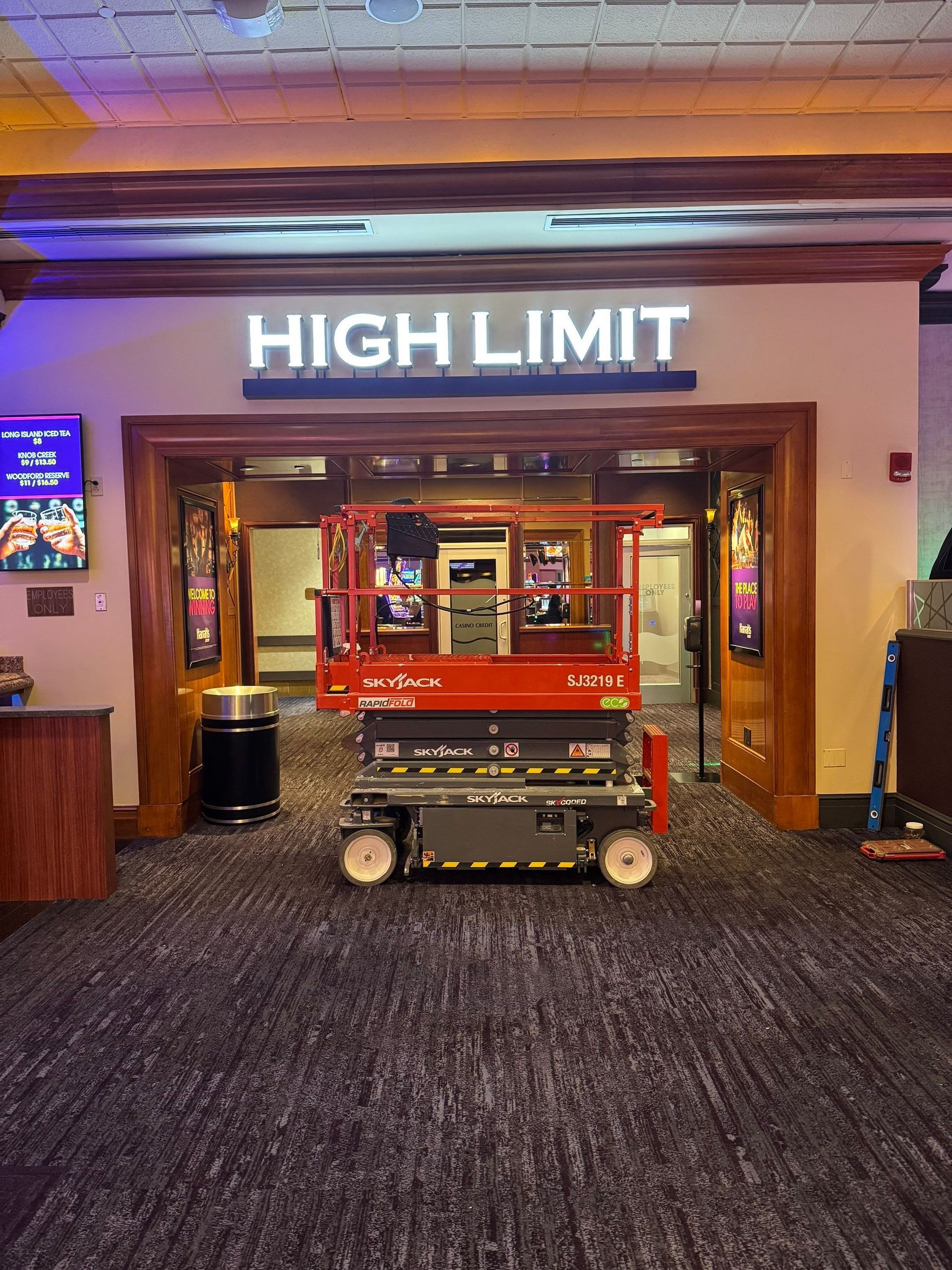 Entrance to High Limit casino with a red maintenance lift in the doorway