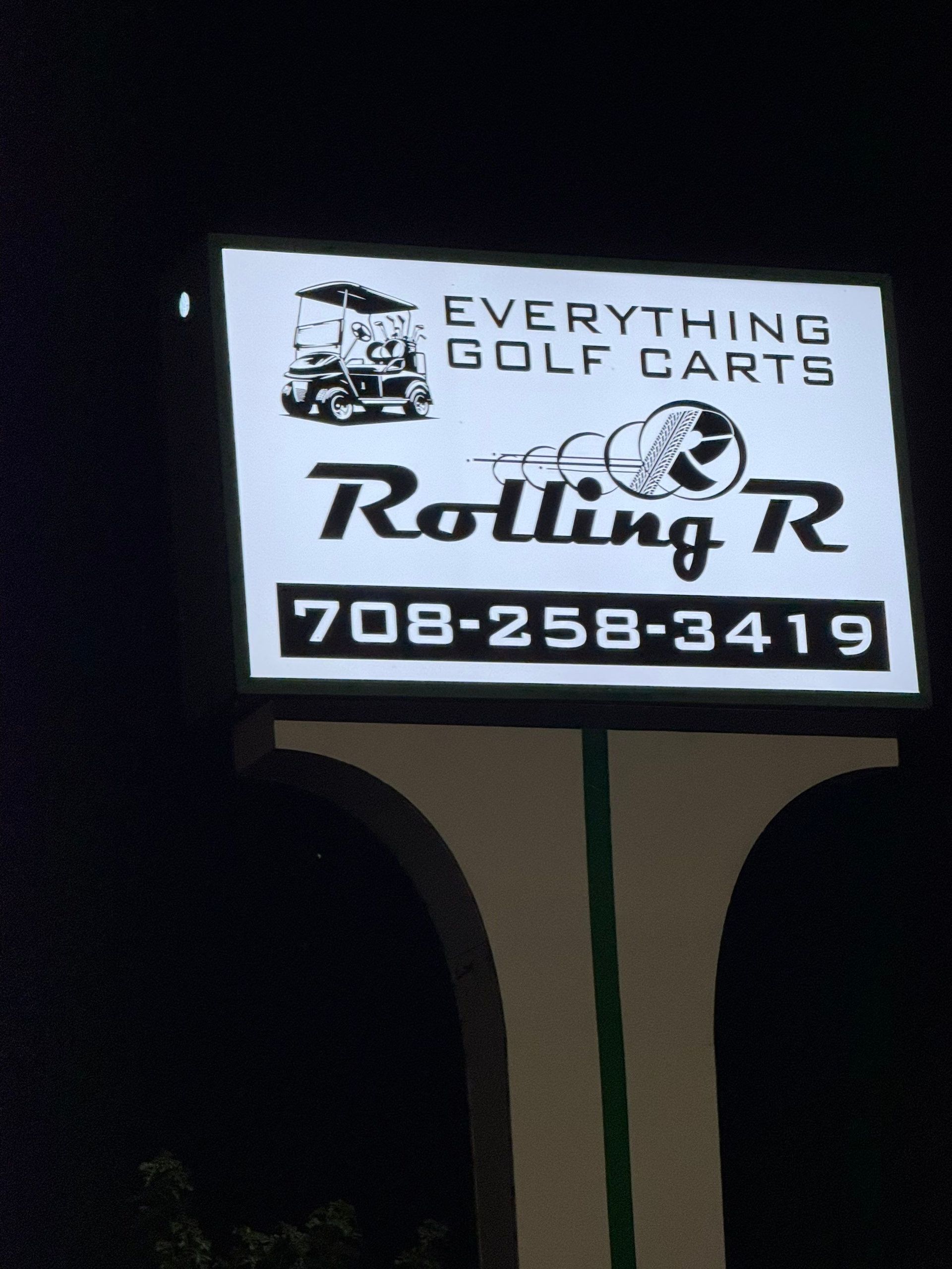 Sign for Everything Golf Carts and Rolling R, with phone number 708-258-3419 at night