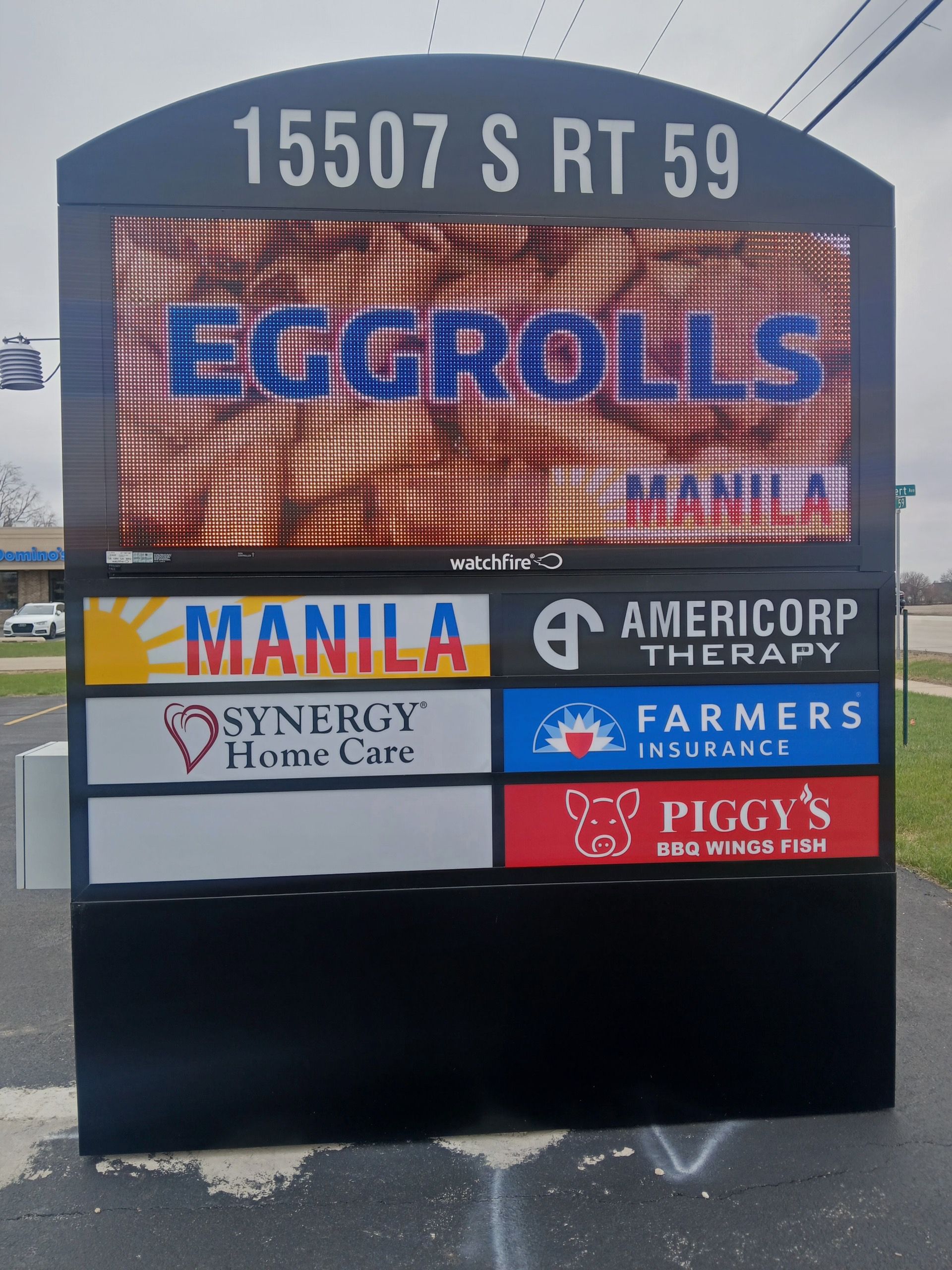 Roadside business sign for Eggrolls and multiple tenants at 15507 S Rt 59