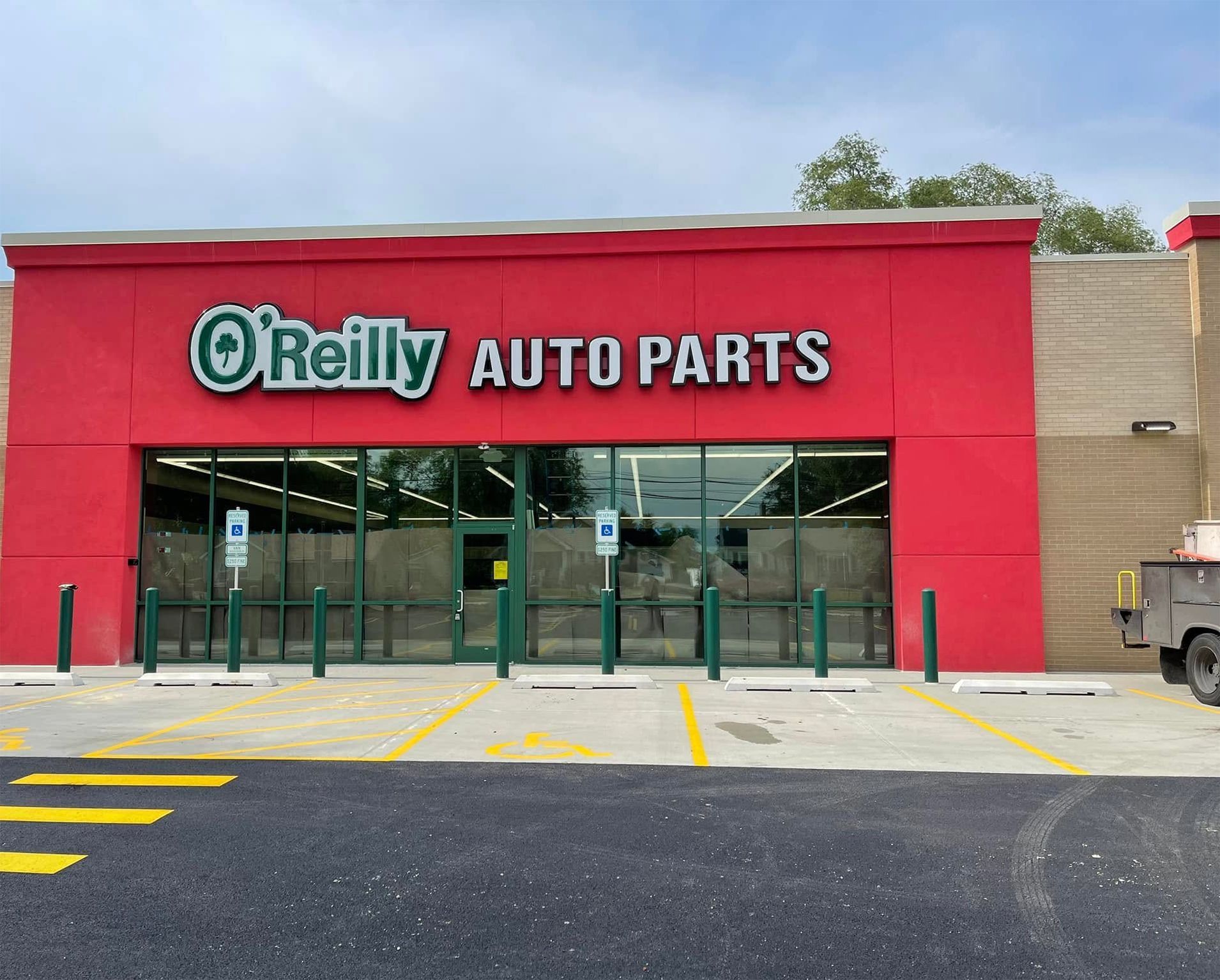 O’Reilly Auto Parts storefront with red facade and glass entrance doors