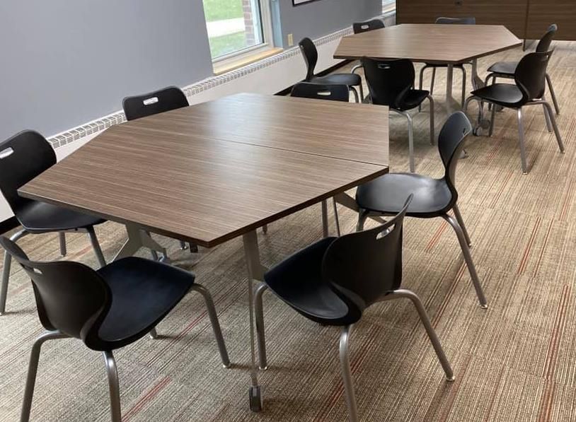 A room with tables and chairs in it