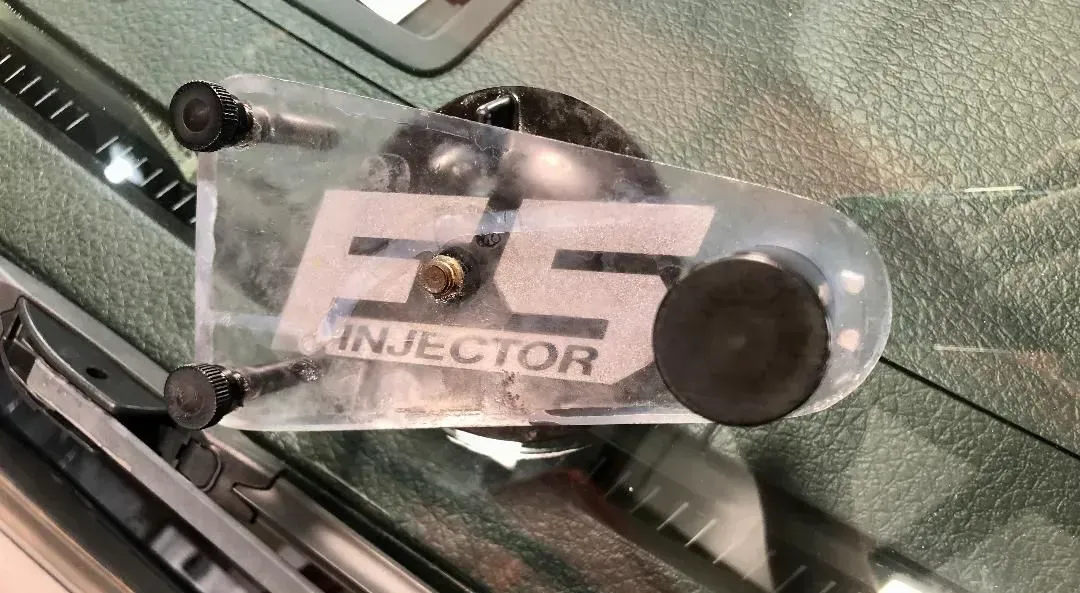 FS Injector sticker on windshield, held with black caps and screws.