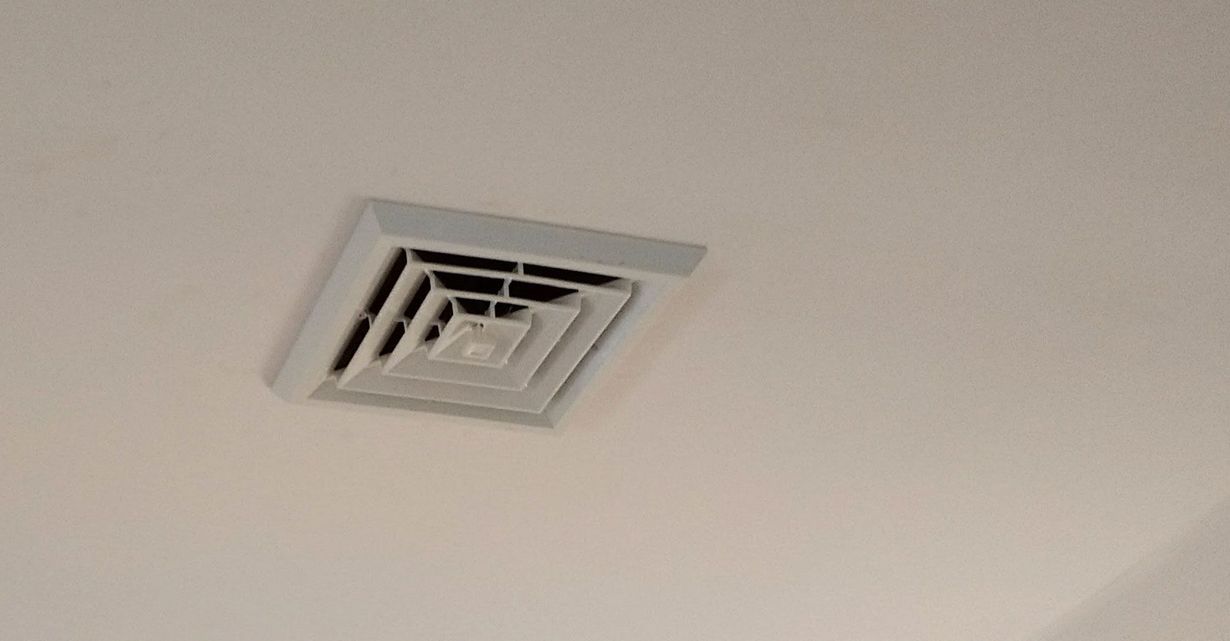 White square ceiling air vent.