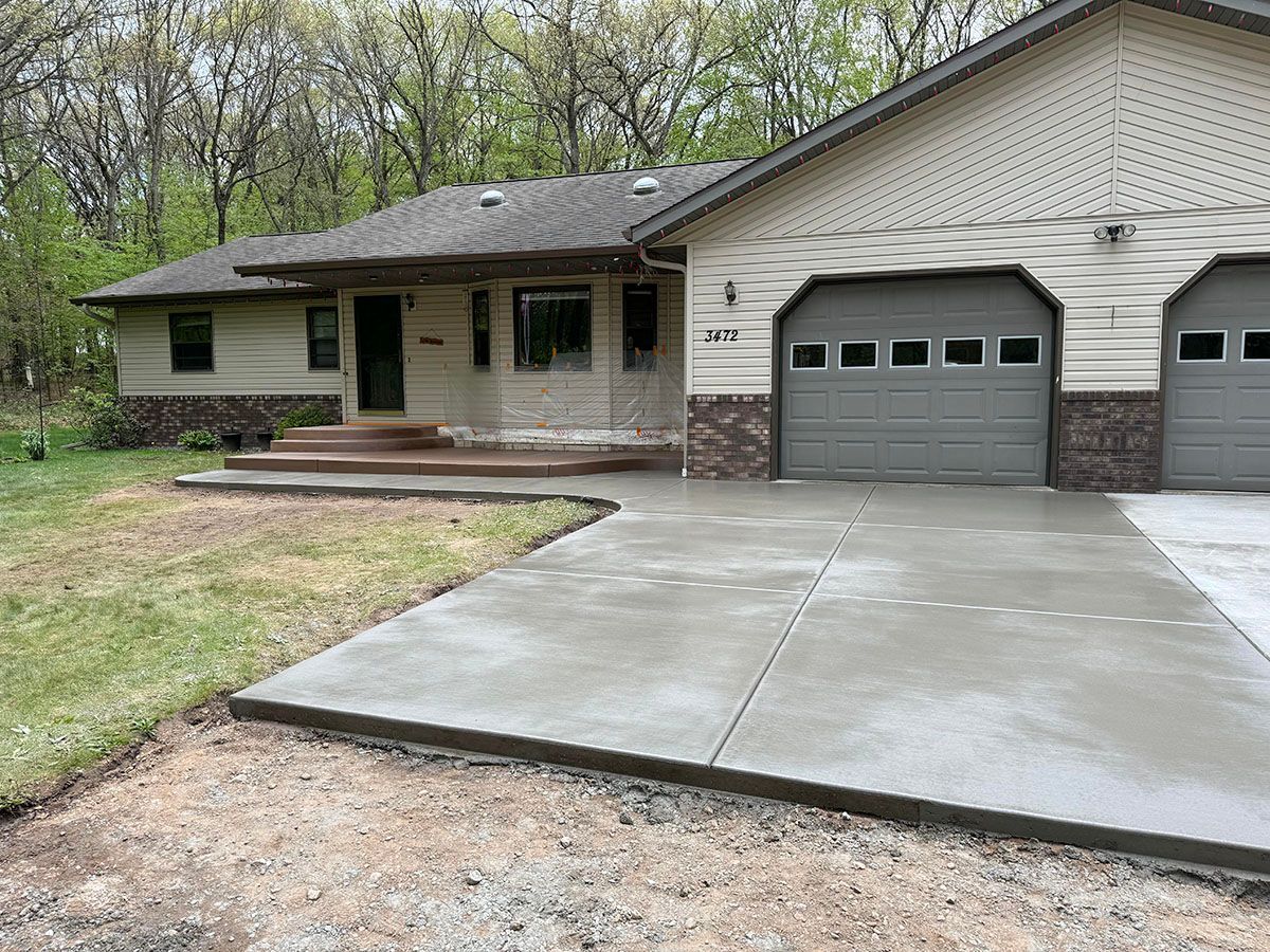 The front of a house with a concrete walkway