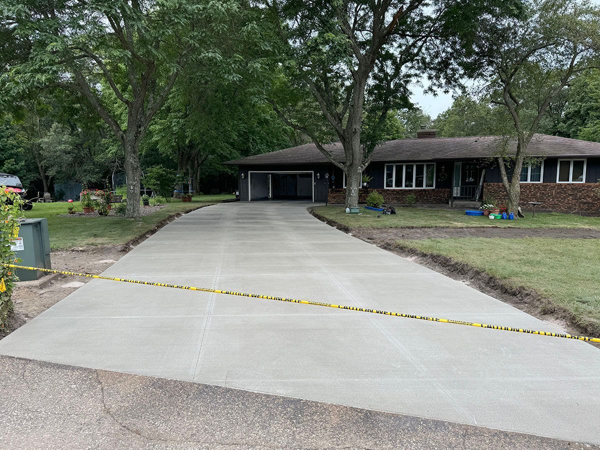 A driveway is being built in front of a house