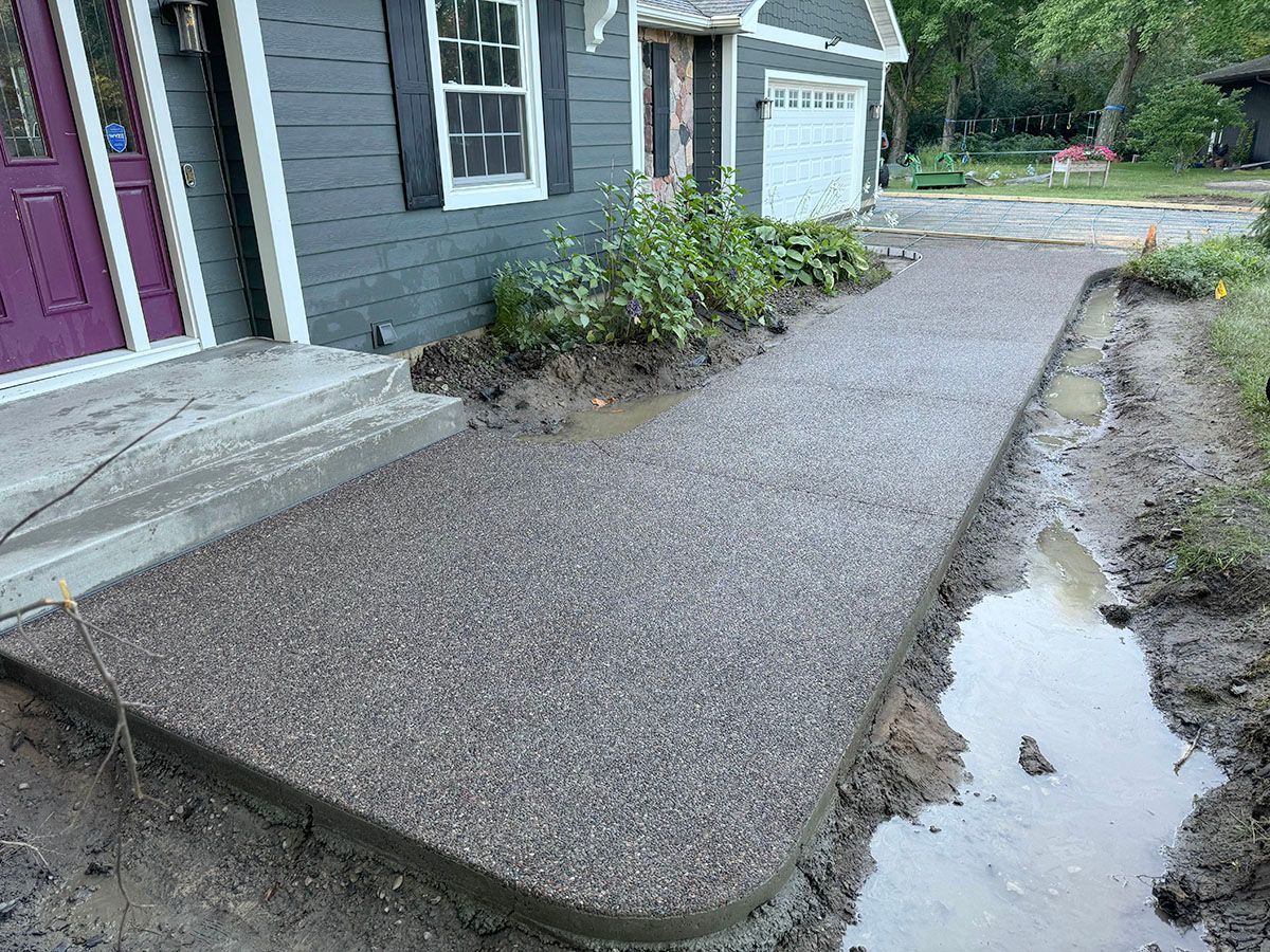A new walkway is being built in front of a house