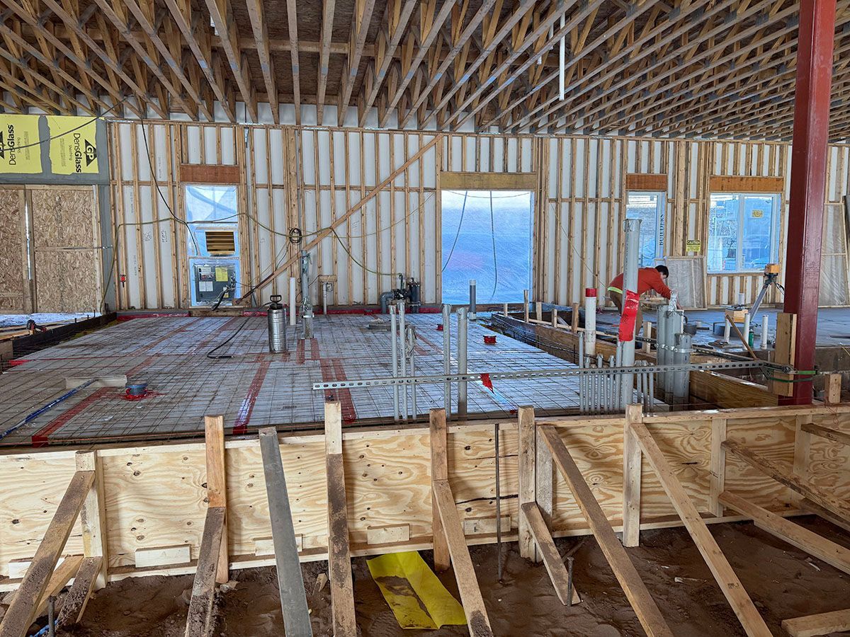 A large building under construction with a lot of wooden beams
